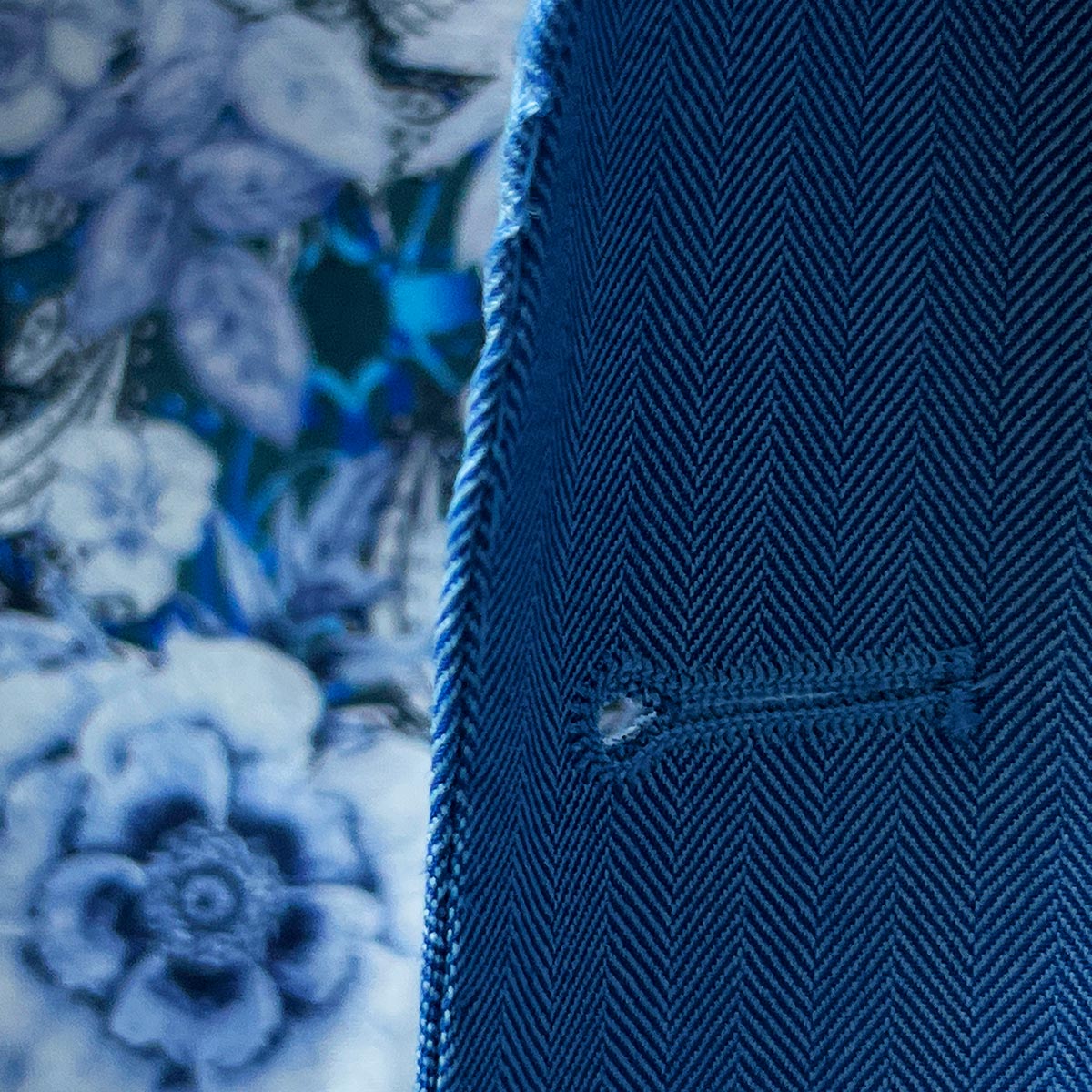 Superior quality men's blue herringbone suit made from Super 120s Australian Merino wool.