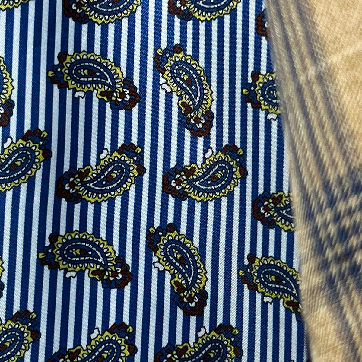 Detail shot of blue striped paisley lining flash when walking