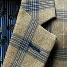 Close-up of notch lapel construction showing plaid pattern alignment