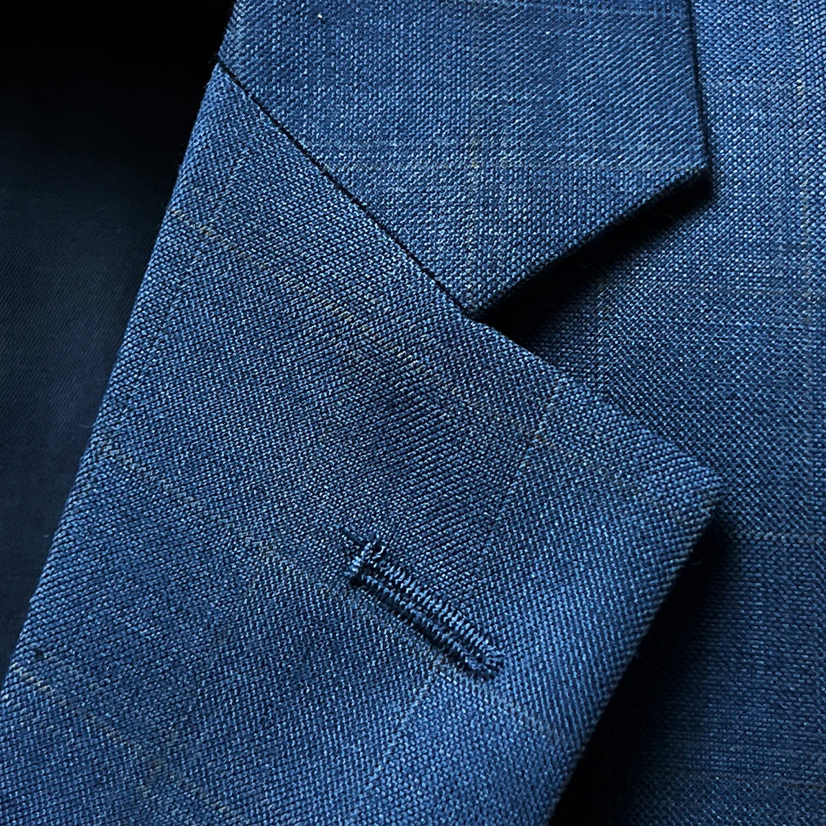 Close-up of notch lapel showing clean lines and pattern matching