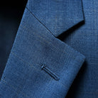 Close-up of notch lapel showing clean lines and pattern matching