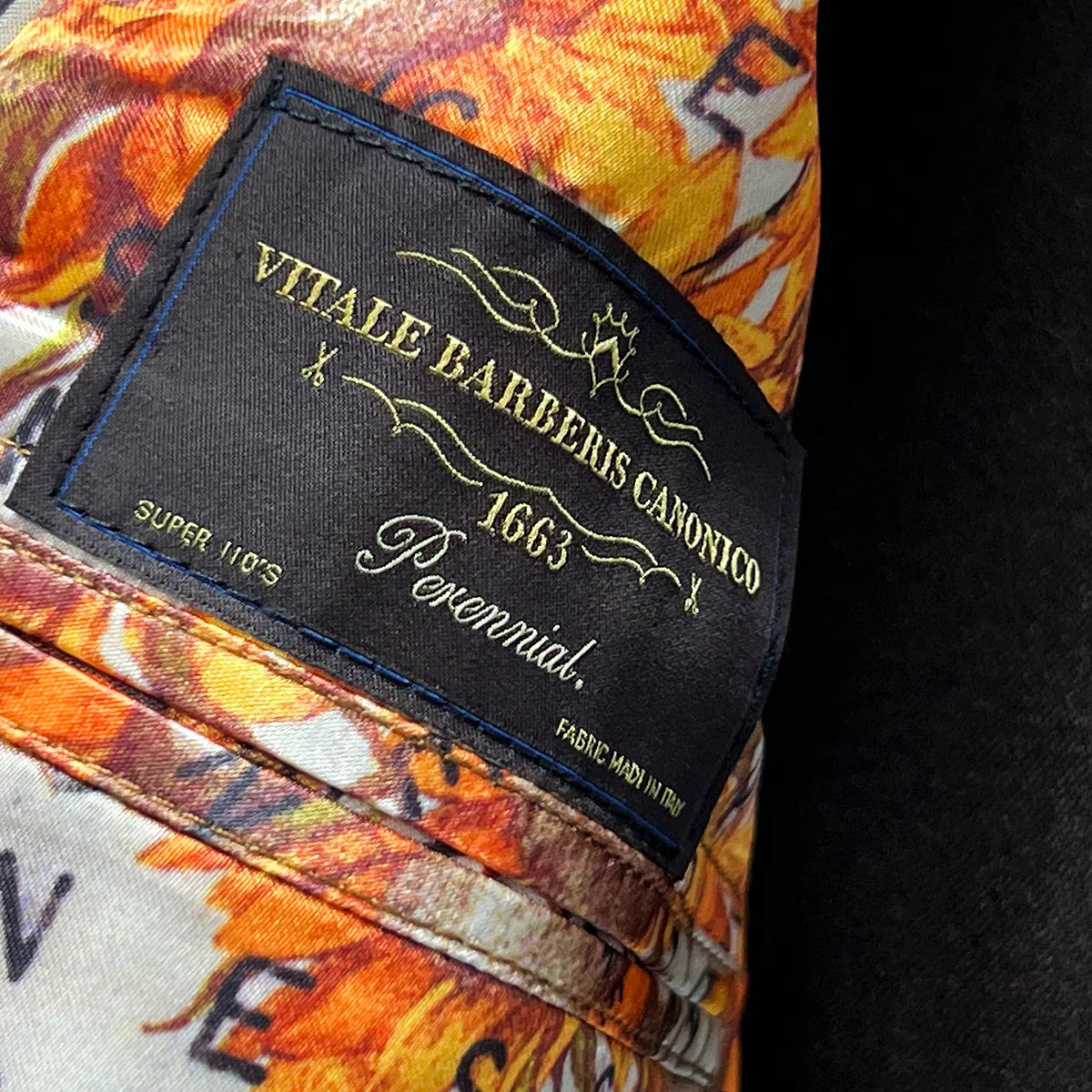 Close-up texture detail of Italian Super 110's wool plain weave fabric showing fine weave construction