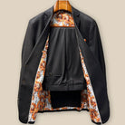 Complete two-piece dark brown plain weave custom suit displayed on hanger showing jacket and trousers