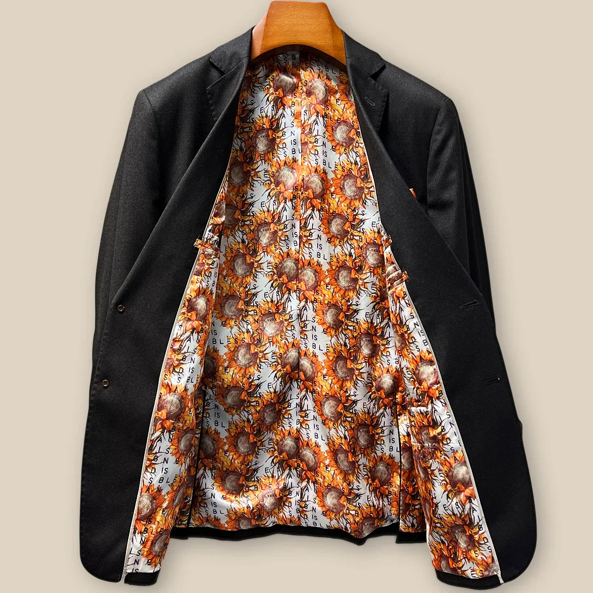 Full interior view of custom suit jacket showcasing luxurious sunflower floral fancy lining with Vitale Barberis Canonico branding
