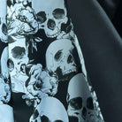 Colorful flash lining detail visible at jacket cuffs and vents in black and white skull pattern