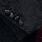 Tuxedo jacket sleeve cuff showing functional buttonholes with contrast black satin accent stitching on self floral fabric