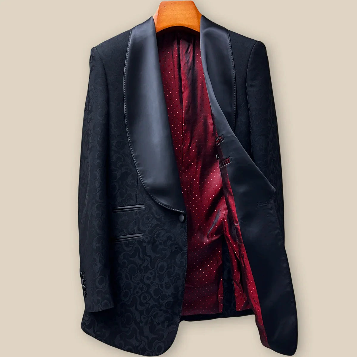 Interior right side of black self floral tuxedo jacket revealing polka dot lining and internal construction details