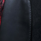 Classic shawl lapel detail on black self floral tuxedo jacket showing hand pick stitching and satin trim