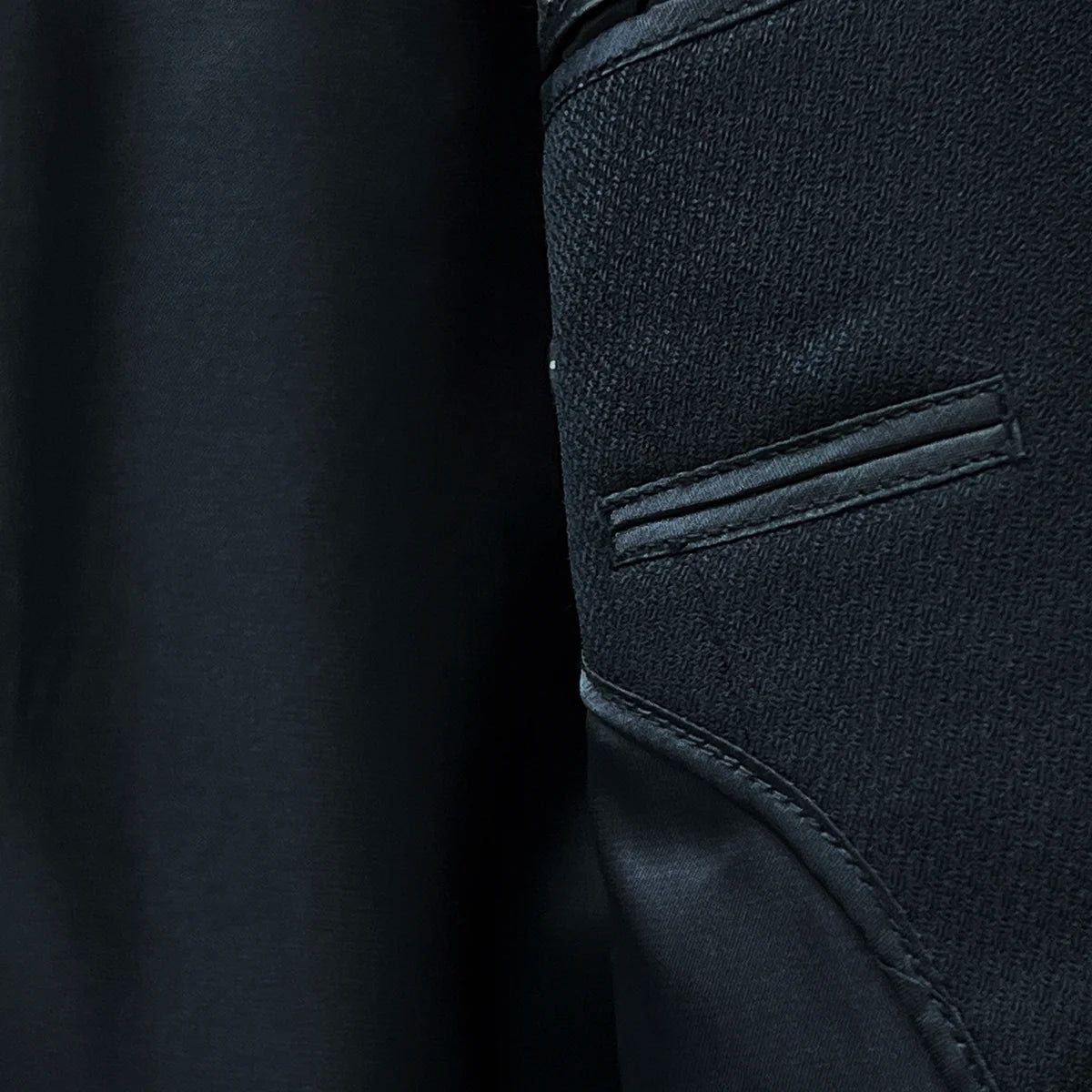 Close-up of the smooth black Bemberg silk lining inside a Westwood Hart suit jacket