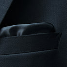 Close-up of a built-in pocket square detail on a black Westwood Hart suit jacket