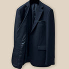 Interior view of the right side of a black Westwood Hart suit jacket, showing inner pockets and lining details