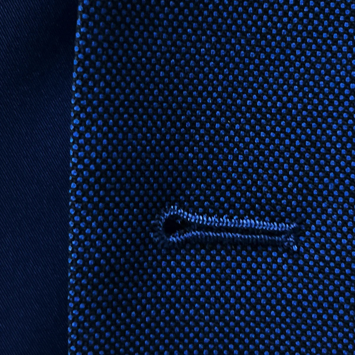 Macro shot of precise buttonhole stitching detail