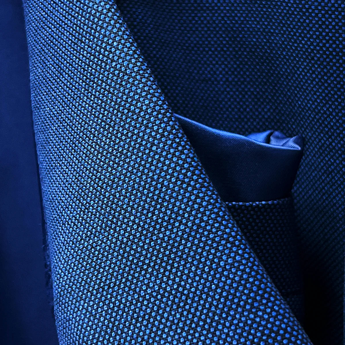 Close-up of the notch lapel construction and stitching detail