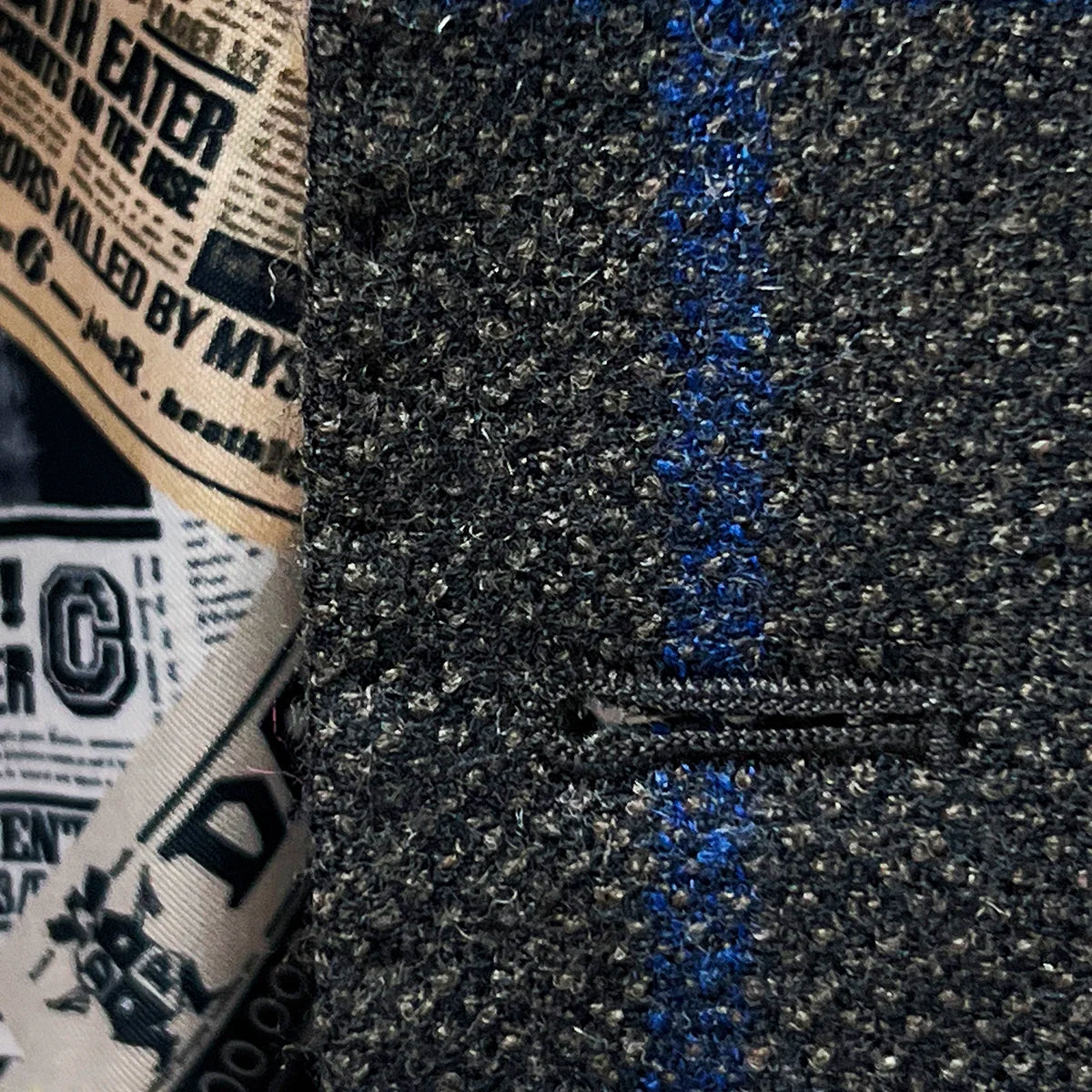 Detailed view of the matching pick stitching on the buttonholes of the Westwood Hart sportcoat.