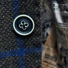Detailed view of the navy horn buttons with white trimming on the Westwood Hart brown with royal blue windowpane sportcoat.