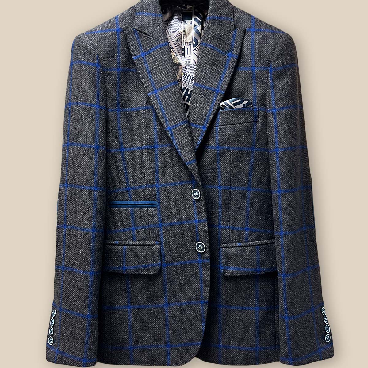 Close-up of the jacket button panel with navy horn buttons featuring white trimming on the Westwood Hart sportcoat.