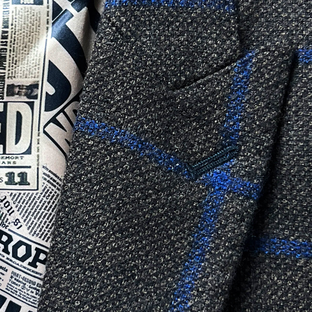 Peak lapel detail on the Westwood Hart brown with royal blue windowpane sportcoat.