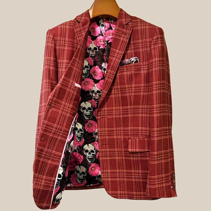 Interior right side of burgundy plaid sport coat revealing floral skulls lining and internal construction details