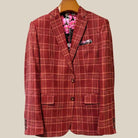 Front button panel of burgundy plaid sport coat featuring burgundy marble buttons and hand pick stitching