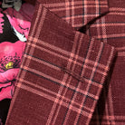 Classic notch lapel detail on burgundy plaid sport coat showing hand pick stitching and plaid check pattern