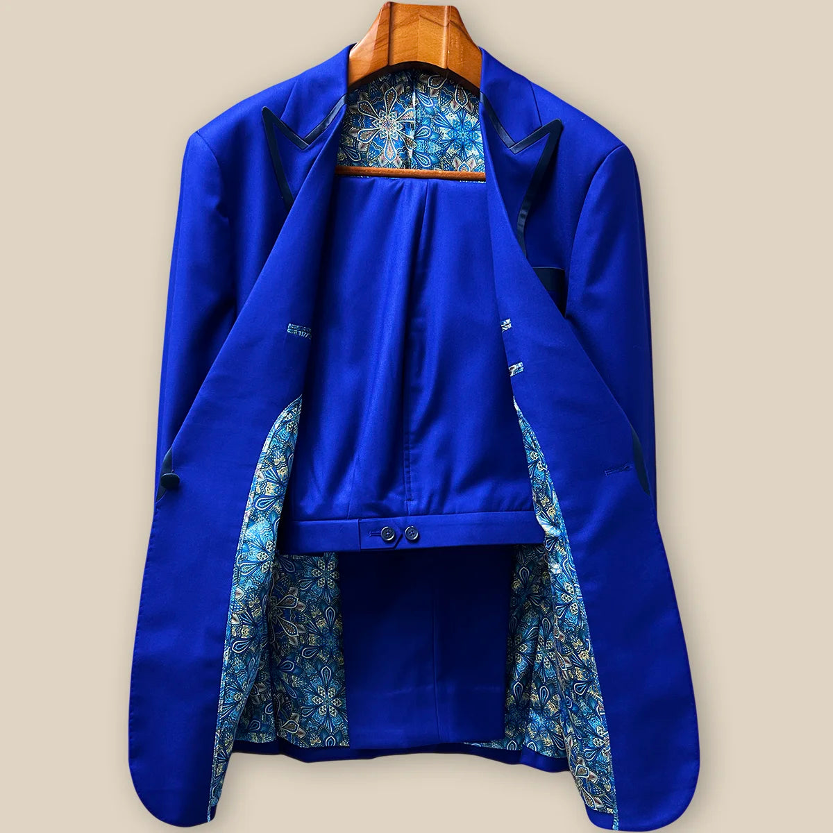 Front view of a complete two-piece Westwood Hart tuxedo in cobalt blue Super 120s wool with navy silk satin peak lapels, displaying elegant formal silhouette