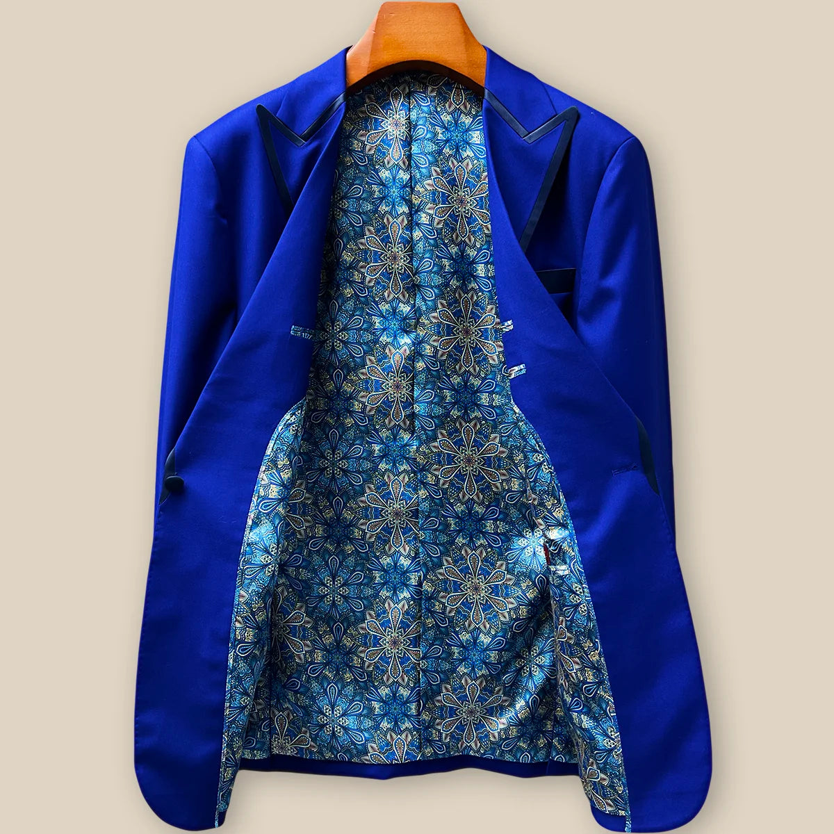 Full view of the blue and cream geometric pattern fancy lining inside a Westwood Hart cobalt blue tuxedo, showcasing handcrafted interior details