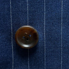 Detailed view of brown horn buttons, showcasing their unique marbling