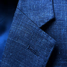 Close-up of notch lapel construction showing fabric texture and stitching