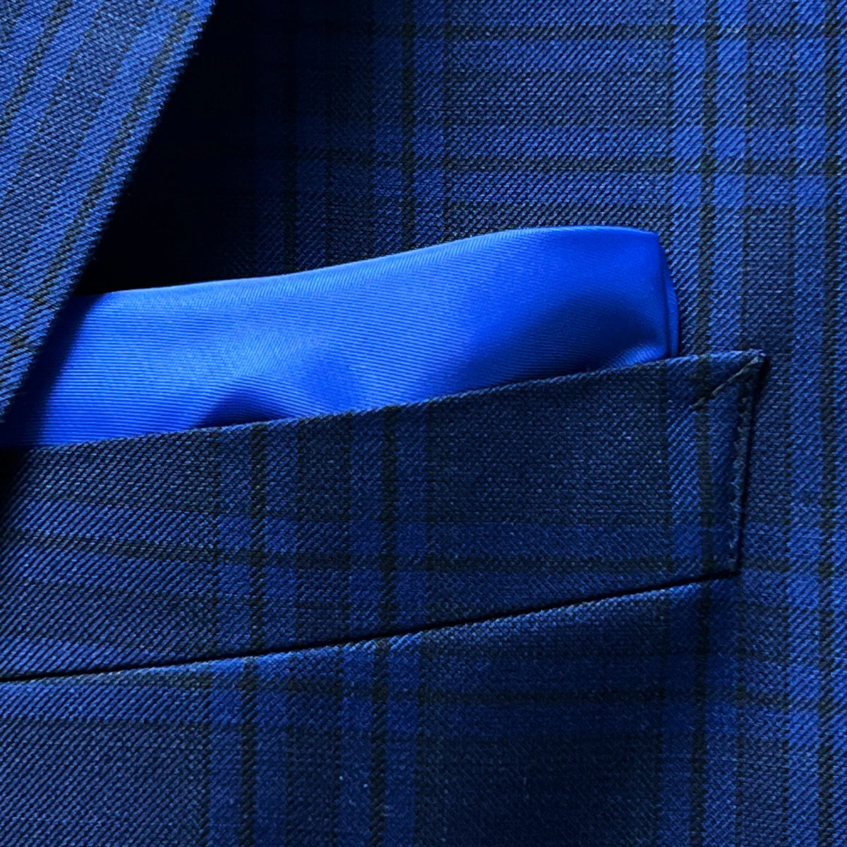 Close-up of built-in pocket square feature in dark blue Westwood Hart suit jacket