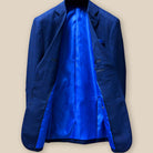 Full interior view of dark blue Westwood Hart suit jacket, displaying luxurious royal blue silk bemberg lining