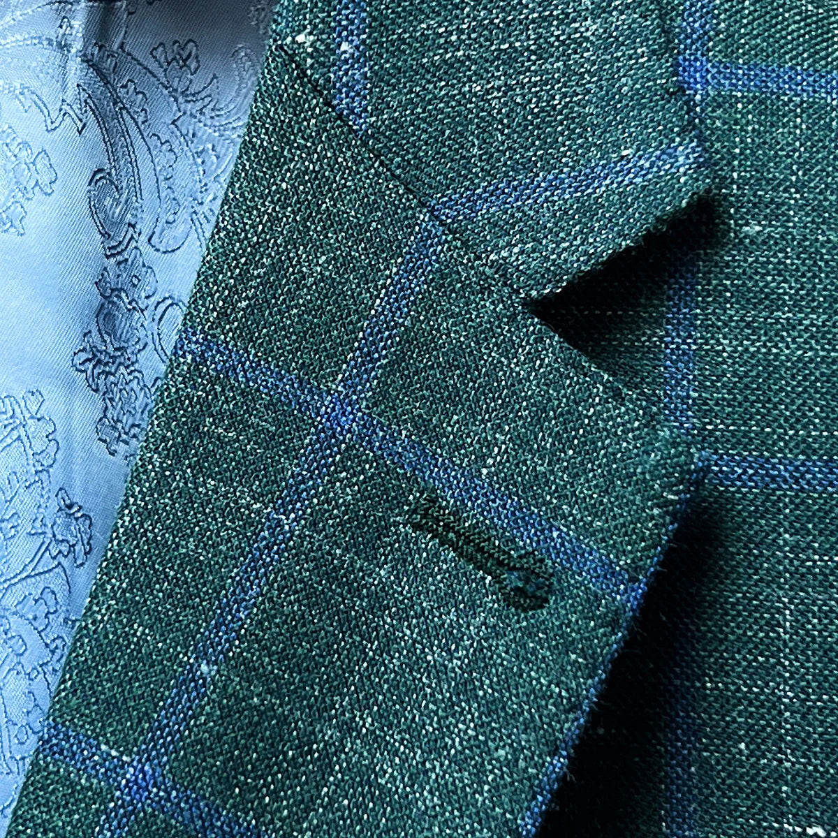 Close-up of notch lapel on dark green Westwood Hart windowpane sport coat, highlighting the classic lapel style