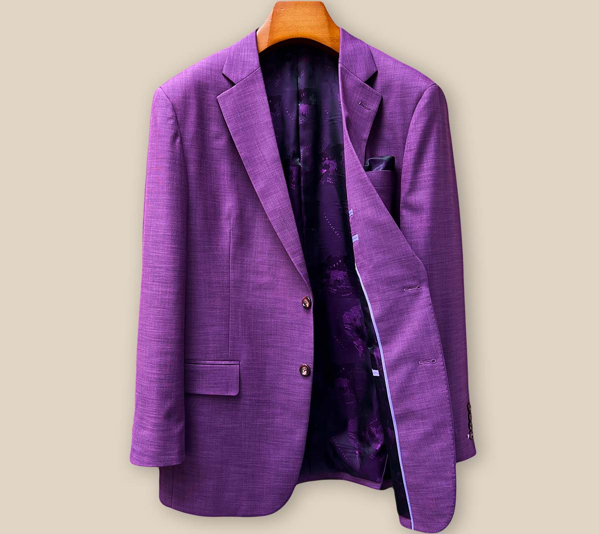 Interior left side view of custom purple sport coat revealing luxurious purple world map lining and expert tailoring construction