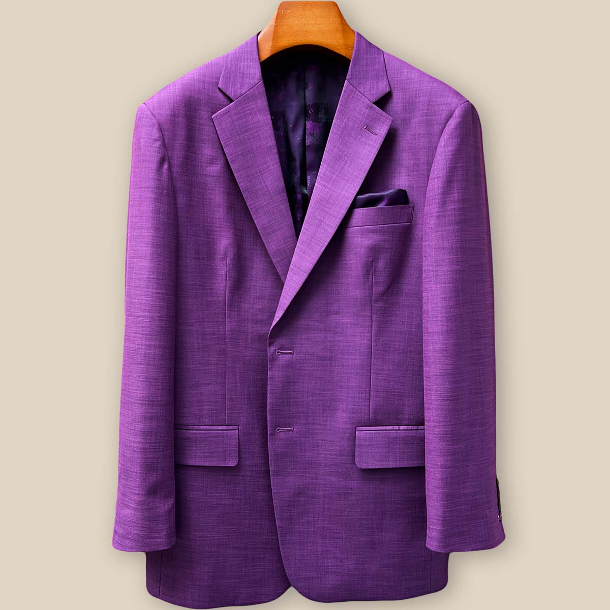 Custom dark orchid purple sport coat displaying elegant lilac contrast buttonholes on the jacket sleeve panel with mulberry horn buttons