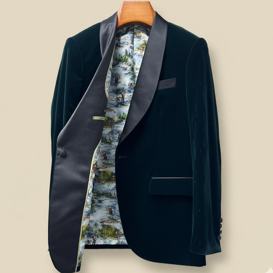 Dark green velvet blazer with floral lining on a beige background