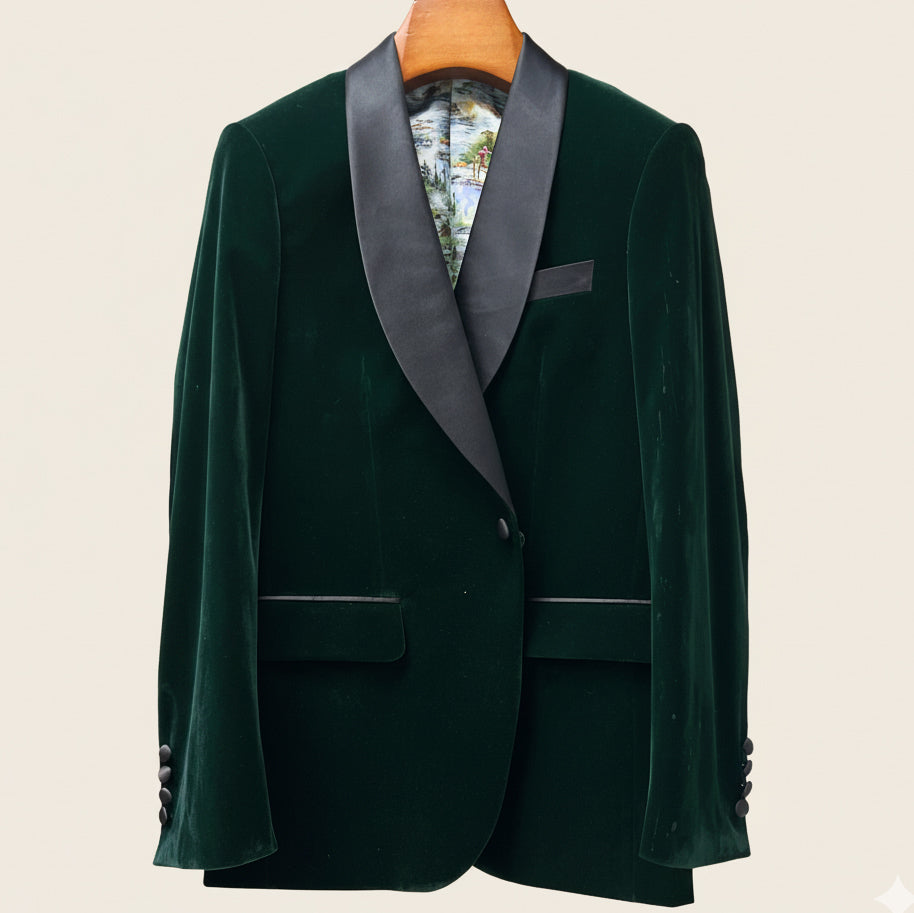 Green velvet tuxedo jacket with gray lapels on a beige background