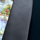 Black tie with a colorful fishing scene on a gray background