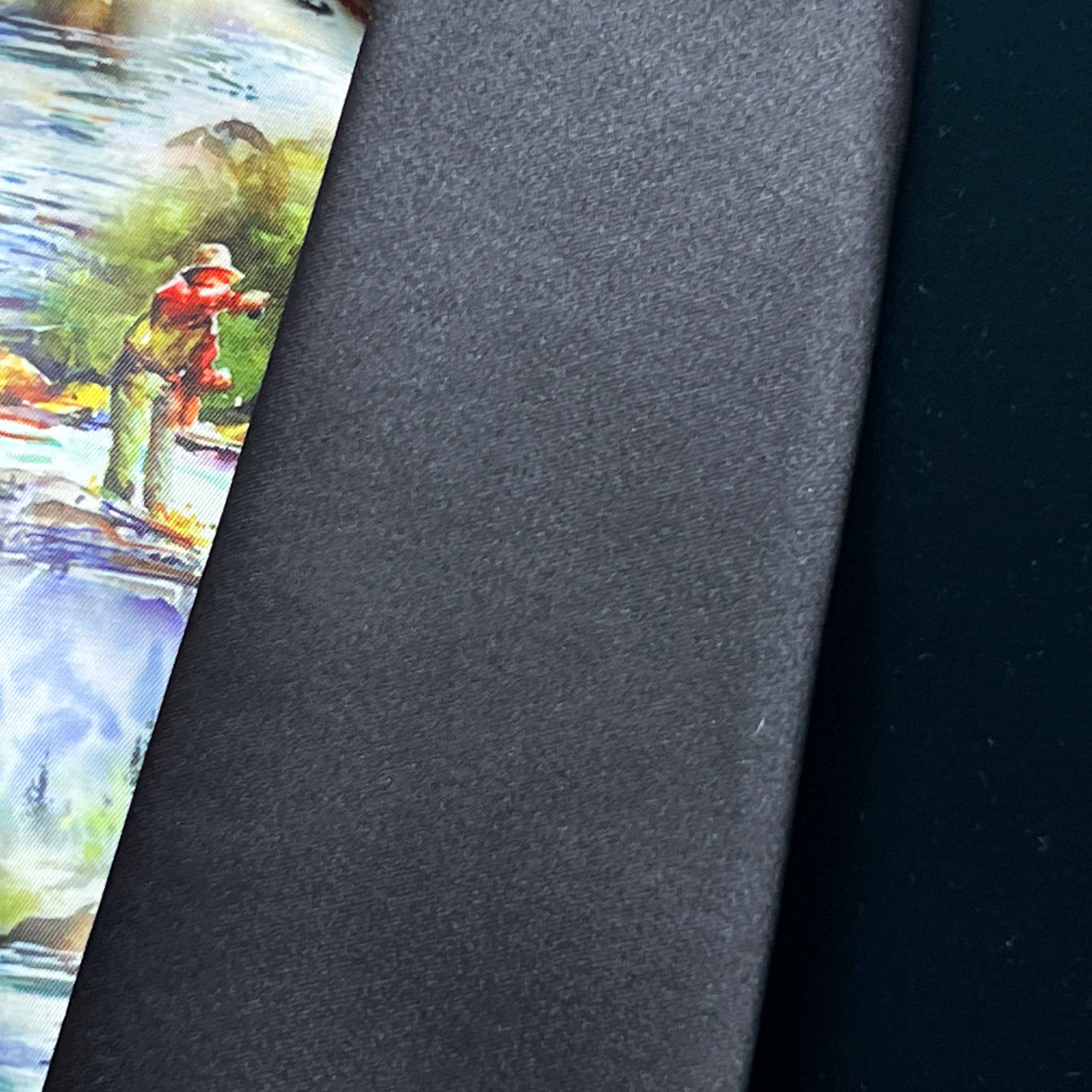 Black tie with a colorful fishing scene on a gray background