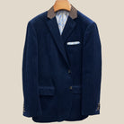 Front button panel of deep navy blue corduroy sport coat featuring tortoiseshell brown horn buttons and hand pick stitching