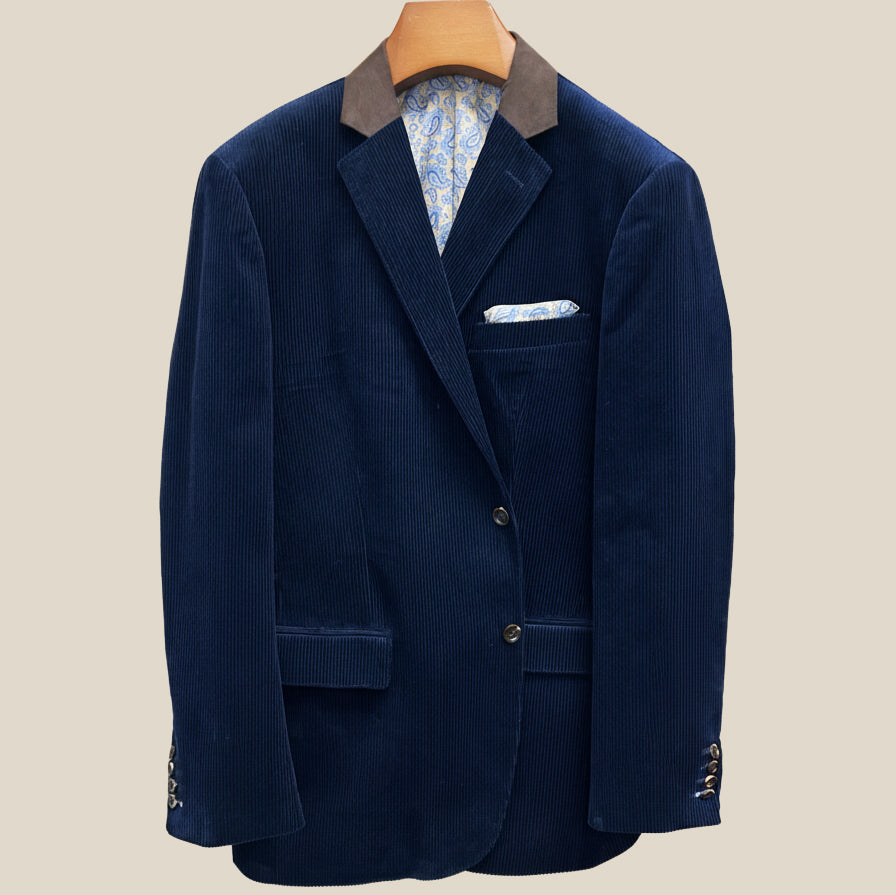 Front button panel of deep navy blue corduroy sport coat featuring tortoiseshell brown horn buttons and hand pick stitching