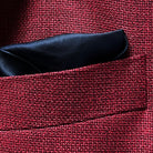 Breast pocket of deep red basketweave sport coat jacket with built-in pocket square holder and hand-finished edges