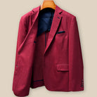 Interior right side of deep red basketweave sport coat jacket revealing navy lining and internal construction details