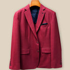 Front button panel of deep red basketweave sport coat jacket featuring dark red horn buttons and hand pick stitching