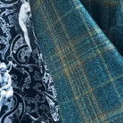 Close-up of premium bamboo fabric texture showing deep teal green multi check plaid pattern weave