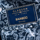 Full front view of deep teal green multi check suit jacket showing notch lapels