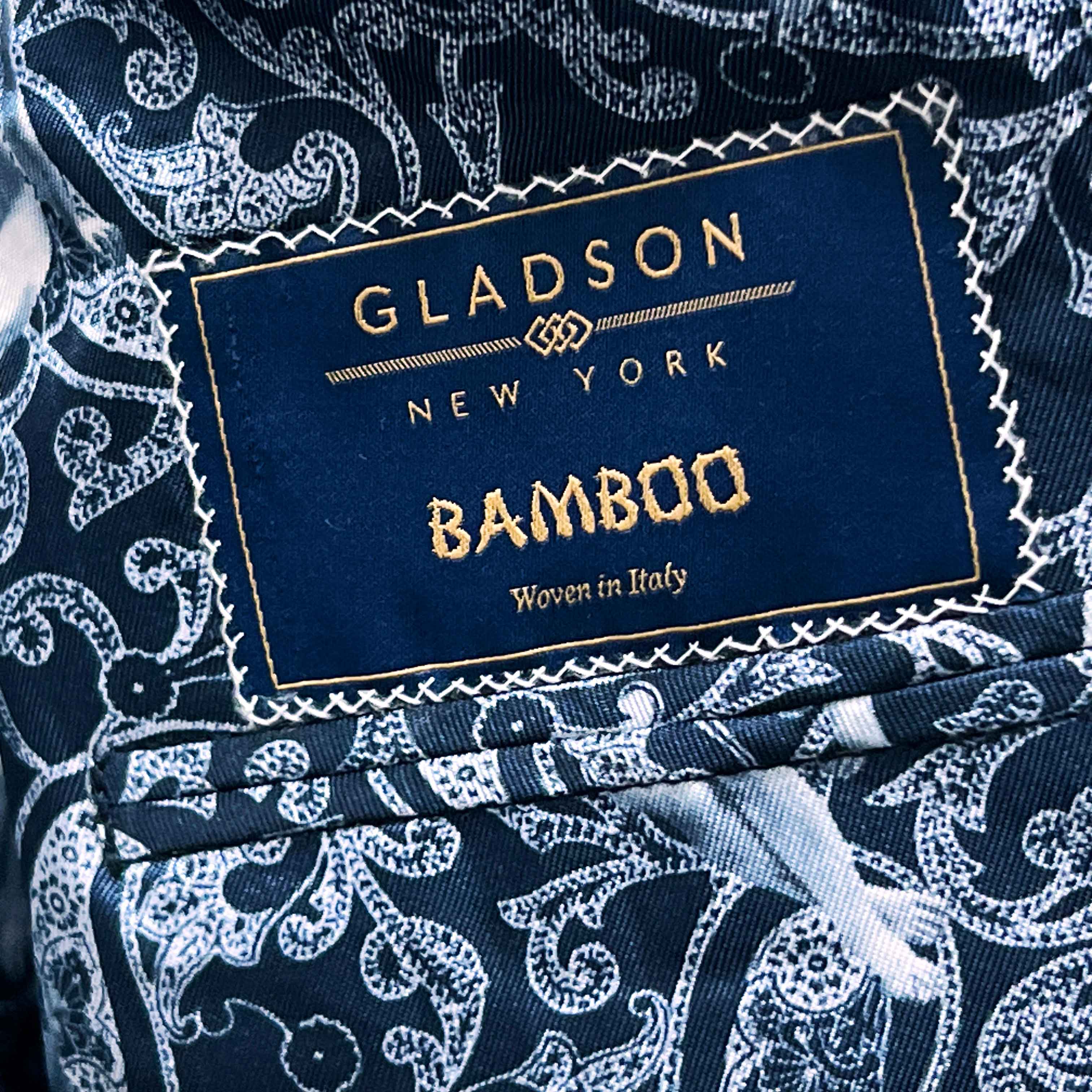 Full front view of deep teal green multi check suit jacket showing notch lapels