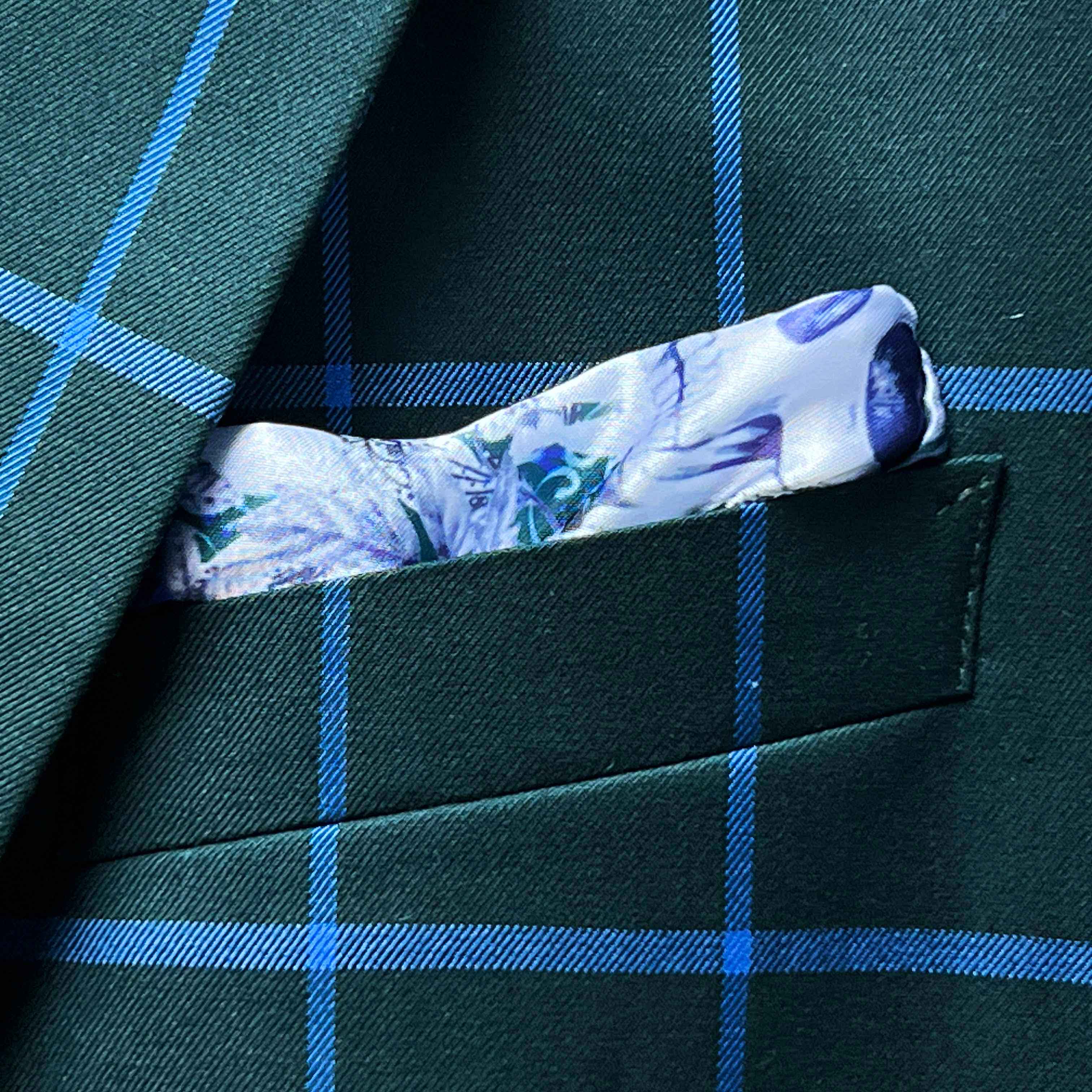 Breast pocket of forest green windowpane sport coat with built-in pocket square holder and hand-finished edges