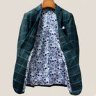 Full interior view of custom sport coat showcasing luxurious white and light blue floral and skull pattern lining with Westwood Hart branding