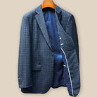 Interior view of left jacket panel showcasing blue and white polka dot lining with crisp white piping detail