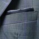 Close-up of suit jacket breast pocket with built-in pocket square in complementary color