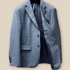 Interior view of grey suit jacket's left side, displaying inner pockets and grey bemberg lining